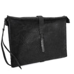 hand stitched over a 50hr period the washed cordovan clutch bag features deconstructed side panels, hand forged iron hardware and a riri zipper closure adorned with solid .925 sterling silver zipper pulls. the bag is available to buy online from avant garde leather studio atelierskn.com