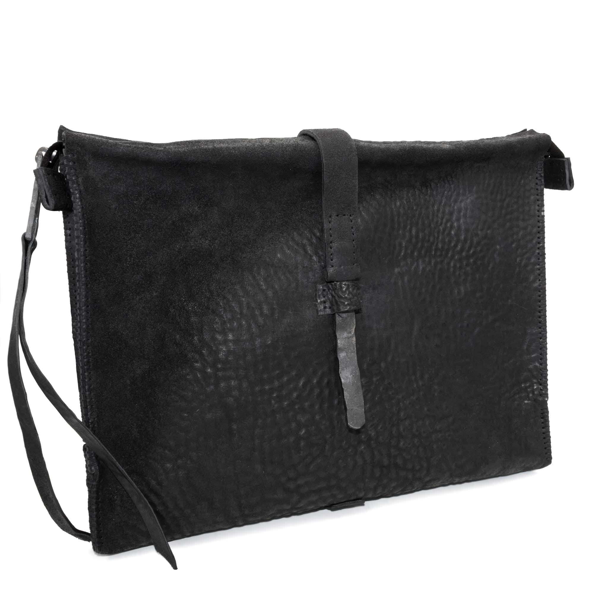 hand stitched over a 50hr period the washed cordovan clutch bag features deconstructed side panels, hand forged iron hardware and a riri zipper closure adorned with solid .925 sterling silver zipper pulls. the bag is available to buy online from avant garde leather studio atelierskn.com