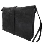 hand stitched over a 50hr period the washed cordovan clutch bag features deconstructed side panels, hand forged iron hardware and a riri zipper closure adorned with solid .925 sterling silver zipper pulls. the bag is available to buy online from avant garde leather studio atelierskn.com