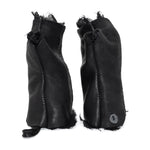 hand stitched over a 35hr period the washed cordovan gloves feature deconstructed open seam panels, hand forged solid .999 sterling silver button and a raw cut stone washed ramie lining. the gloves are available to buy online from avant garde leather studio atelierskn.com 