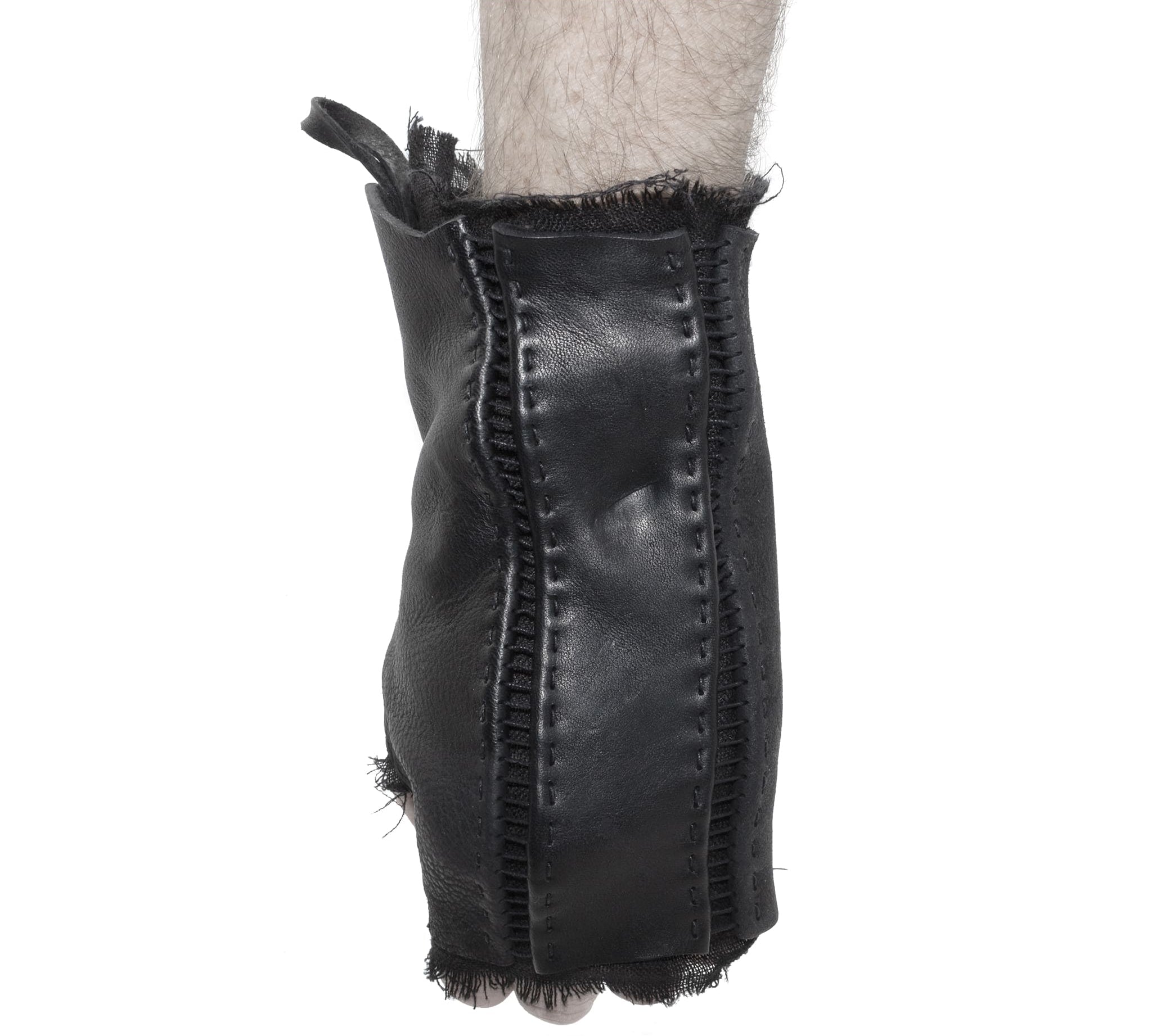 hand stitched over a 35hr period the washed cordovan gloves feature deconstructed open seam panels, hand forged solid .999 sterling silver button and a raw cut stone washed ramie lining. the gloves are available to buy online from avant garde leather studio atelierskn.com 