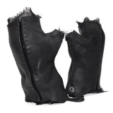 hand stitched over a 35hr period the washed cordovan gloves feature deconstructed open seam panels, hand forged solid .999 sterling silver button and a raw cut stone washed ramie lining. the gloves are available to buy online from avant garde leather studio atelierskn.com 