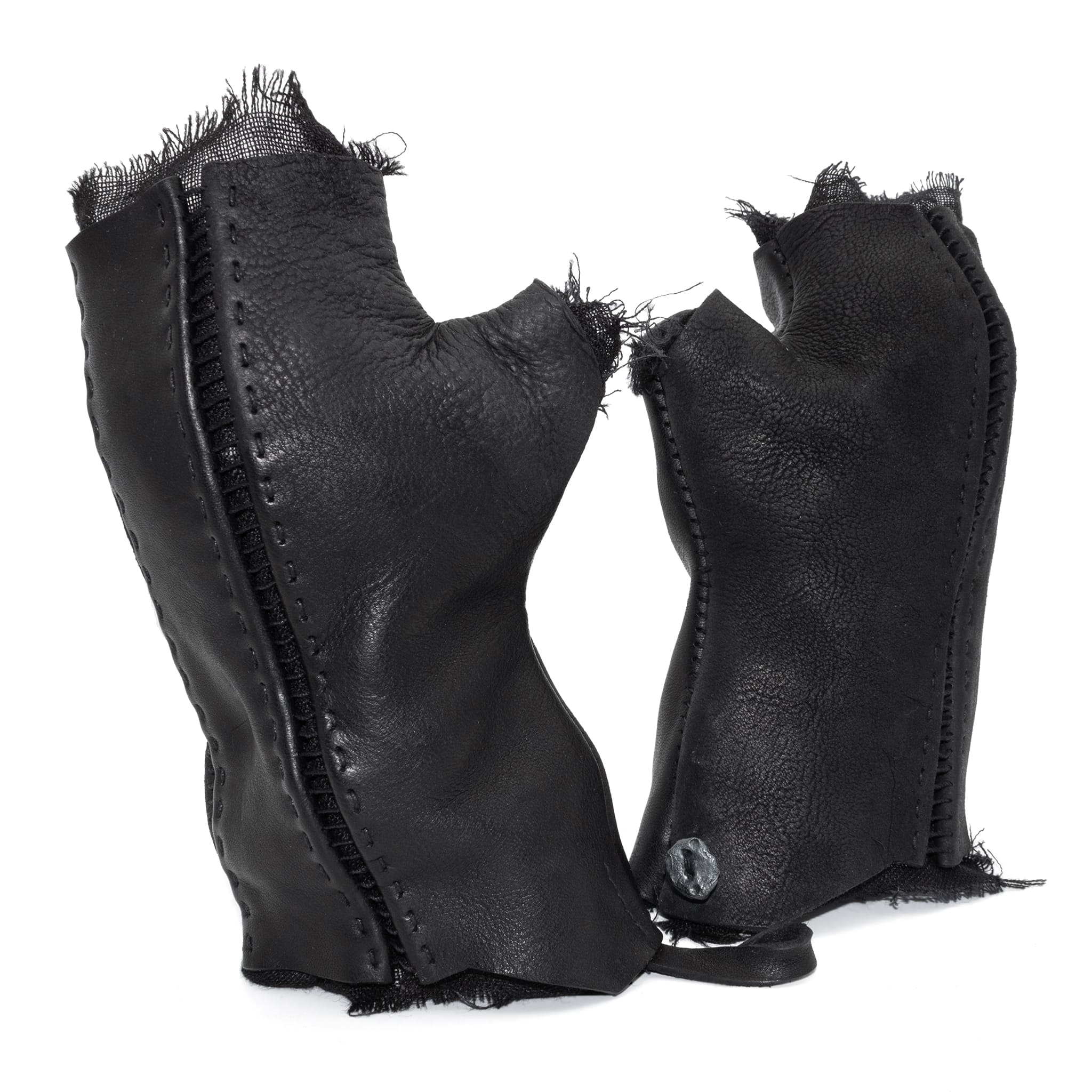hand stitched over a 35hr period the washed cordovan gloves feature deconstructed open seam panels, hand forged solid .999 sterling silver button and a raw cut stone washed ramie lining. the gloves are available to buy online from avant garde leather studio atelierskn.com 