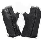 hand stitched over a 35hr period the washed cordovan gloves feature deconstructed open seam panels, hand forged solid .999 sterling silver button and a raw cut stone washed ramie lining. the gloves are available to buy online from avant garde leather studio atelierskn.com 