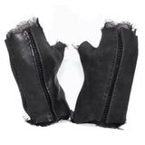 hand stitched over a 35hr period the washed cordovan gloves feature deconstructed open seam panels, hand forged solid .999 sterling silver button and a raw cut stone washed ramie lining. the gloves are available to buy online from avant garde leather studio atelierskn.com 