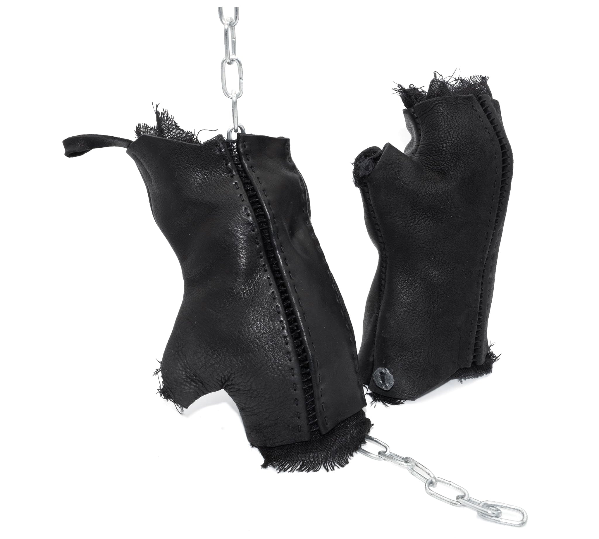 hand stitched over a 35hr period the washed cordovan gloves feature deconstructed open seam panels, hand forged solid .999 sterling silver button and a raw cut stone washed ramie lining. the gloves are available to buy online from avant garde leather studio atelierskn.com 