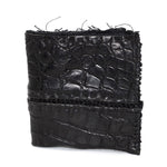 black crocodile leather wallet hand stitched over a 10 hour period. the genuine crocodile leather bifold wallet features multiple card slots, and a japanese ramie lining. an open seam construction and overlocked sides are hand stitched in a japanese linen thread. the wallet is available to buy online from avant garde leather studio atelierskn.com