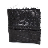 black crocodile leather wallet hand stitched over a 10 hour period. the genuine crocodile leather bifold wallet features multiple card slots, and a japanese ramie lining. an open seam construction and overlocked sides are hand stitched in a japanese linen thread. the wallet is available to buy online from avant garde leather studio atelierskn.com
