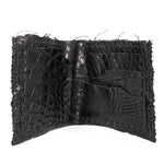 black crocodile leather wallet hand stitched over a 10 hour period. the genuine crocodile leather bifold wallet features multiple card slots, and a japanese ramie lining. an open seam construction and overlocked sides are hand stitched in a japanese linen thread. the wallet is available to buy online from avant garde leather studio atelierskn.com