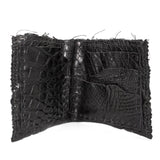 black crocodile leather wallet hand stitched over a 10 hour period. the genuine crocodile leather bifold wallet features multiple card slots, and a japanese ramie lining. an open seam construction and overlocked sides are hand stitched in a japanese linen thread. the wallet is available to buy online from avant garde leather studio atelierskn.com