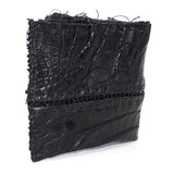 black crocodile leather wallet hand stitched over a 10 hour period. the genuine crocodile leather bifold wallet features multiple card slots, and a japanese ramie lining. an open seam construction and overlocked sides are hand stitched in a japanese linen thread. the wallet is available to buy online from avant garde leather studio atelierskn.com