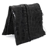 black crocodile leather wallet hand stitched over a 10 hour period. the genuine crocodile leather bifold wallet features multiple card slots, and a japanese ramie lining. an open seam construction and overlocked sides are hand stitched in a japanese linen thread. the wallet is available to buy online from avant garde leather studio atelierskn.com