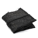 black crocodile leather wallet hand stitched over a 10 hour period. the genuine crocodile leather bifold wallet features multiple card slots, and a japanese ramie lining. an open seam construction and overlocked sides are hand stitched in a japanese linen thread. the wallet is available to buy online from avant garde leather studio atelierskn.com