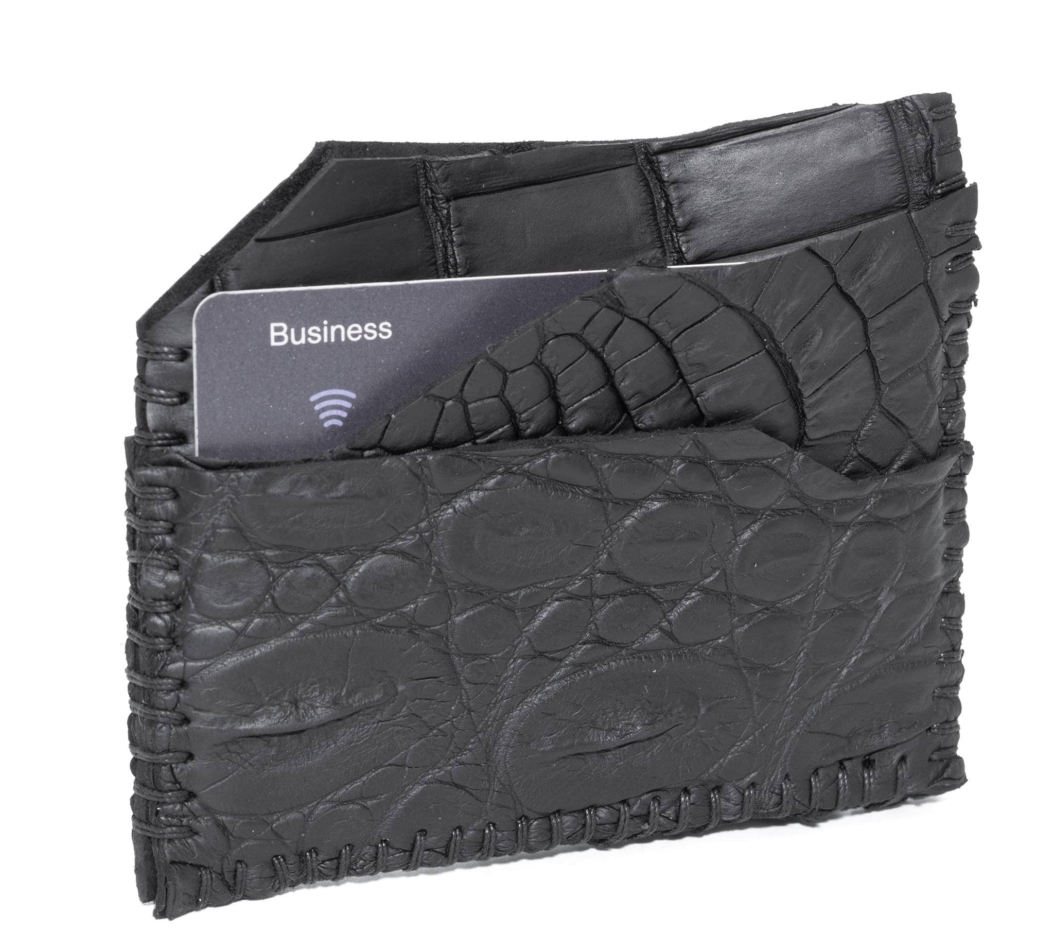 hand stitched over an 8 hour period the genuine crocodile cardholder features multiple card slots, hand stitched overlock sides and an array of unique textures. the cardholder is available to buy online from avant garde leather studio atelierskn.com