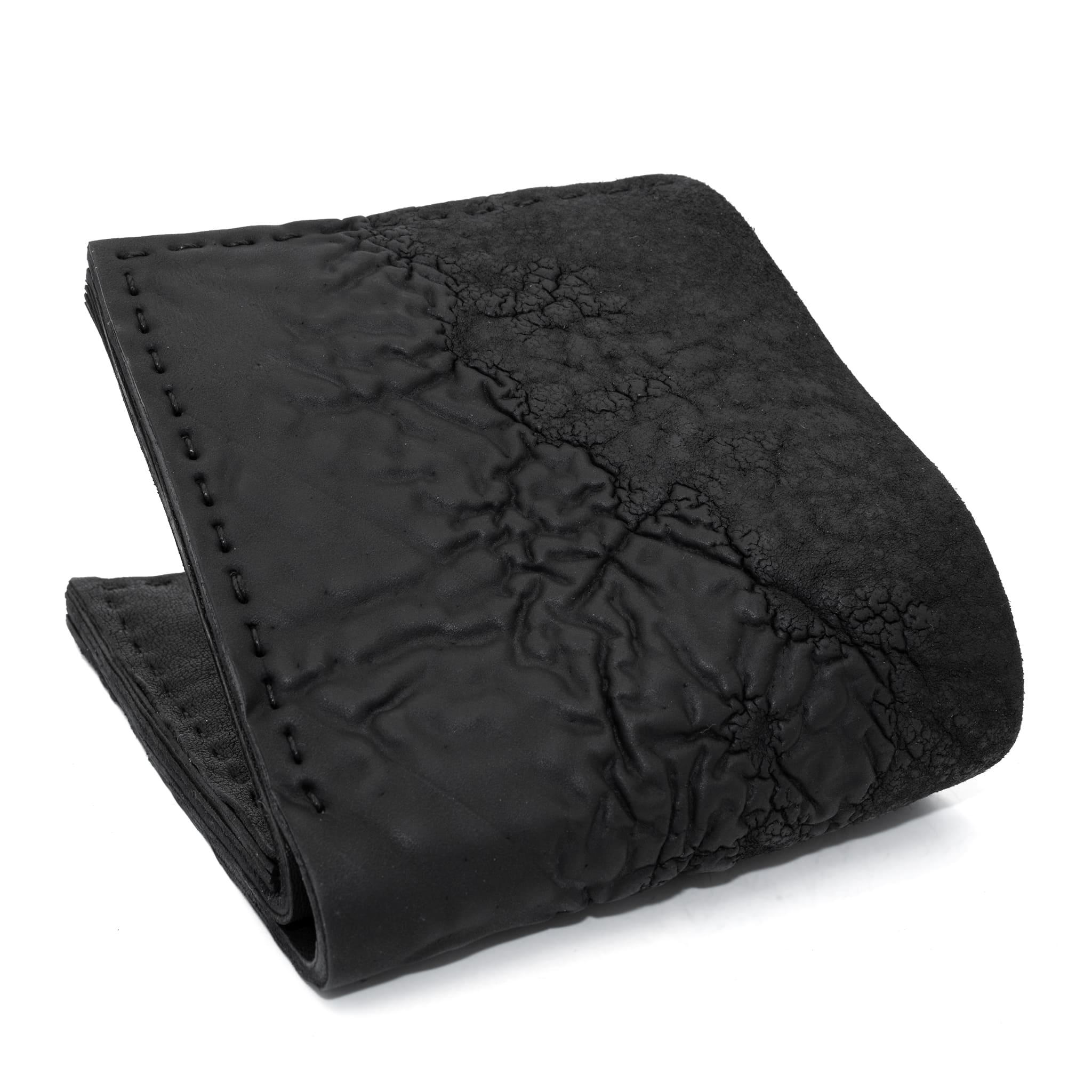 a closed seam 8 pocket bifold wallet crafted from a butter soft reverse culatta leather with a matte black object dyed finish. a riri zipper pocket is adorned with a hand forged solid .925sterling silver zipper pull available to buy online from artisanal leather studio atelierskn.com