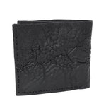 a closed seam 8 pocket bifold wallet crafted from a butter soft reverse culatta leather with a matte black object dyed finish. a riri zipper pocket is adorned with a hand forged solid .925sterling silver zipper pull available to buy online from artisanal leather studio atelierskn.com