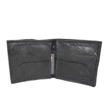a closed seam 8 pocket bifold wallet crafted from a butter soft reverse culatta leather with a matte black object dyed finish. a riri zipper pocket is adorned with a hand forged solid .925sterling silver zipper pull available to buy online from artisanal leather studio atelierskn.com