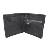 a closed seam 8 pocket bifold wallet crafted from a butter soft reverse culatta leather with a matte black object dyed finish. a riri zipper pocket is adorned with a hand forged solid .925sterling silver zipper pull available to buy online from artisanal leather studio atelierskn.com