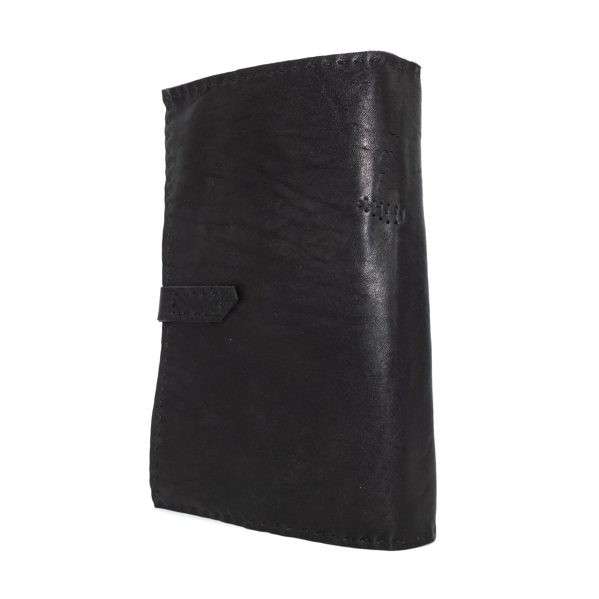 Hand stitched matte black horse culatta leather journal with a hand forged coffin nail closure and 80 pages of handmade cotton rag paper available to buy online from avant garde leather studio atelier skn.