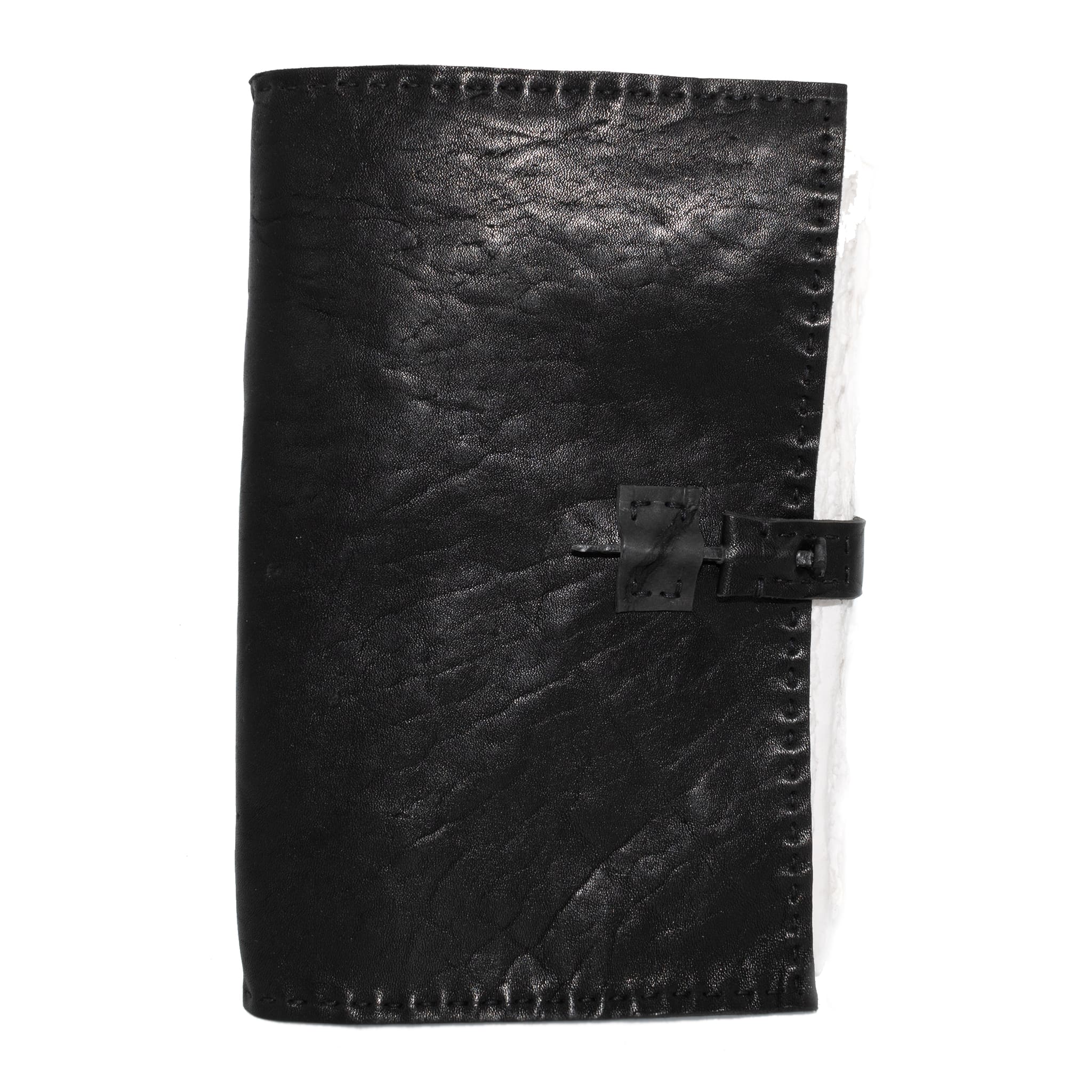 Hand stitched matte black horse culatta leather journal with a hand forged coffin nail closure and 80 pages of handmade cotton rag paper available to buy online from avant garde leather studio atelier skn.