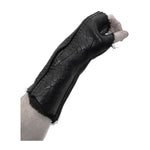 hand stitched over a 40hr period the washed culatta leather gloves feature deconstructed open seam panels, and a stone washed ramie lining. wet moulded on the body over an 8 hour period for a sculptured aesthetic. the gloves are available to buy online from avant garde leather studio atelierskn.com