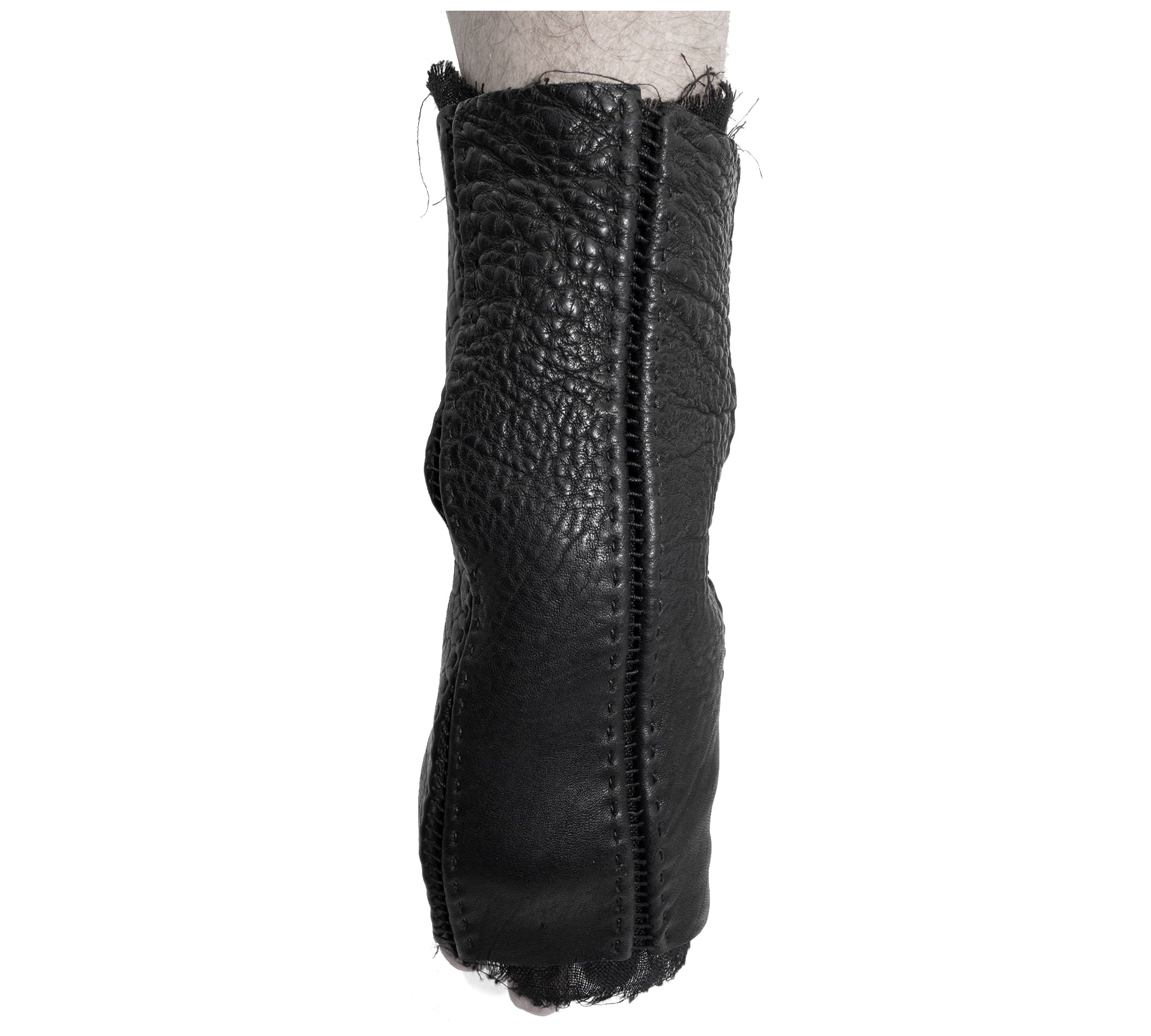 hand stitched over a 40hr period the washed culatta leather gloves feature deconstructed open seam panels, and a stone washed ramie lining. wet moulded on the body over an 8 hour period for a sculptured aesthetic. the gloves are available to buy online from avant garde leather studio atelierskn.com