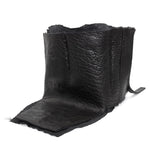 a matte black full grain horse culatta leather collar, meticulously hand stitched with an open seam construction. the scarf features a stonewashed ramie lining and riri zipper closures adorned with hand forged .925 sterling silver zipper pulls. available to buy online from avant garde leather studio atelierskn.com