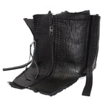 a matte black full grain horse culatta leather collar, meticulously hand stitched with an open seam construction. the scarf features a stonewashed ramie lining and riri zipper closures adorned with hand forged .925 sterling silver zipper pulls. available to buy online from avant garde leather studio atelierskn.com