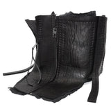 a matte black full grain horse culatta leather collar, meticulously hand stitched with an open seam construction. the scarf features a stonewashed ramie lining and riri zipper closures adorned with hand forged .925 sterling silver zipper pulls. available to buy online from avant garde leather studio atelierskn.com