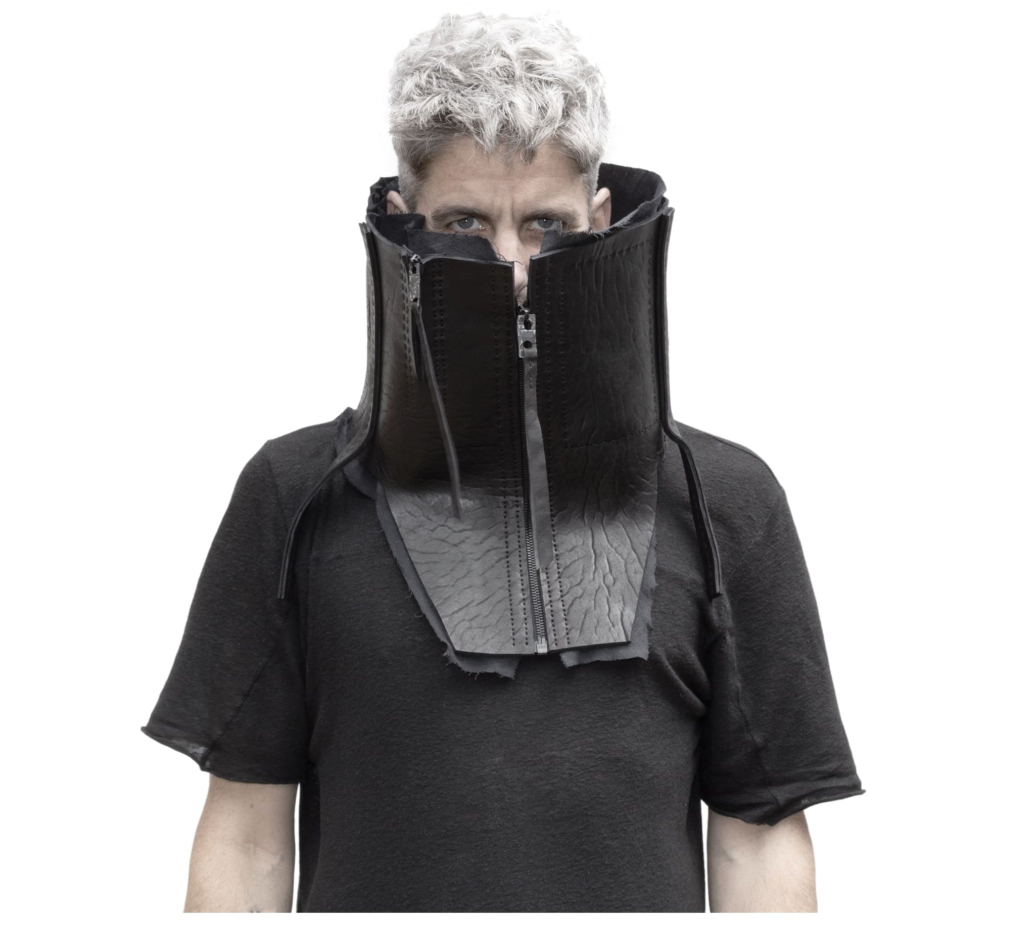 a matte black full grain horse culatta leather collar, meticulously hand stitched with an open seam construction. the scarf features a stonewashed ramie lining and riri zipper closures adorned with hand forged .925 sterling silver zipper pulls. available to buy online from avant garde leather studio atelierskn.com