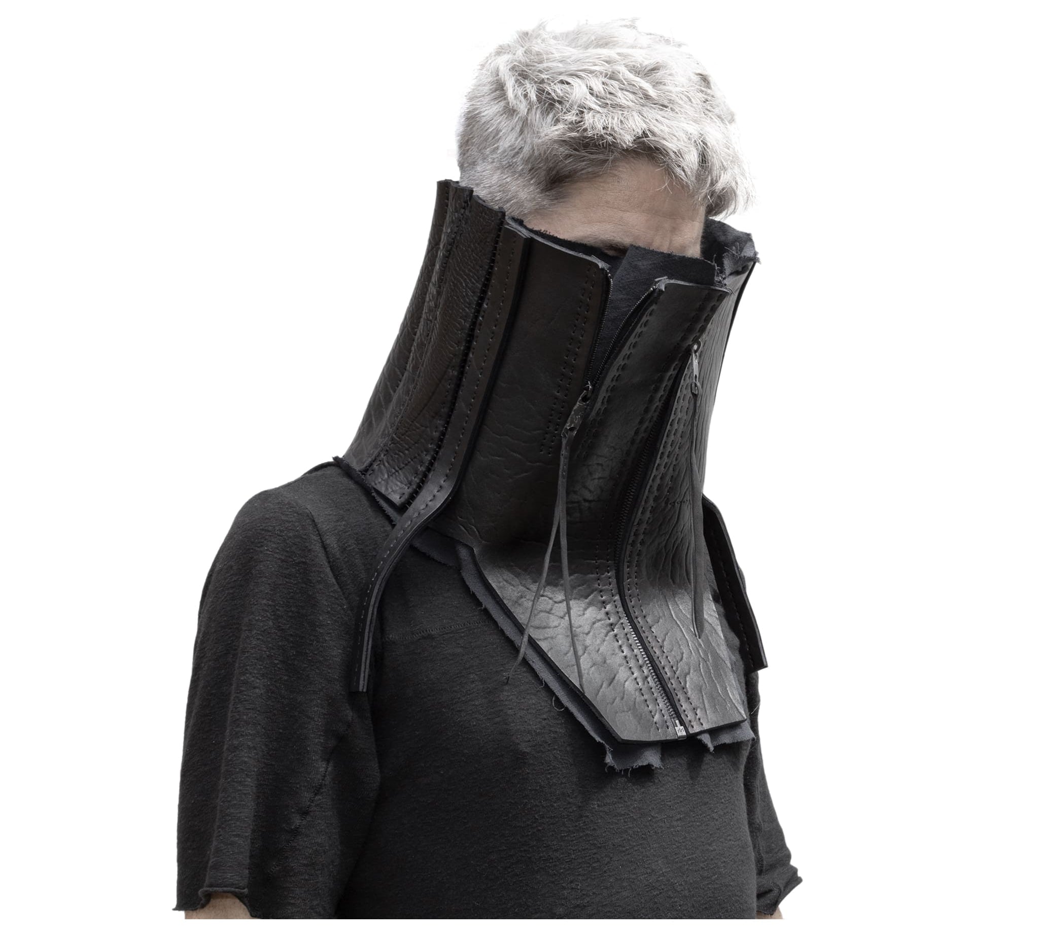a matte black full grain horse culatta leather collar, meticulously hand stitched with an open seam construction. the scarf features a stonewashed ramie lining and riri zipper closures adorned with hand forged .925 sterling silver zipper pulls. available to buy online from avant garde leather studio atelierskn.com