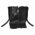 a matte black full grain horse culatta leather collar, meticulously hand stitched with an open seam construction. the scarf features a stonewashed ramie lining and riri zipper closures adorned with hand forged .925 sterling silver zipper pulls. available to buy online from avant garde leather studio atelierskn.com