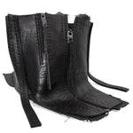 a matte black full grain horse culatta leather collar, meticulously hand stitched with an open seam construction. the scarf features a stonewashed ramie lining and riri zipper closures adorned with hand forged .925 sterling silver zipper pulls. available to buy online from avant garde leather studio atelierskn.com