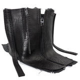 a matte black full grain horse culatta leather collar, meticulously hand stitched with an open seam construction. the scarf features a stonewashed ramie lining and riri zipper closures adorned with hand forged .925 sterling silver zipper pulls. available to buy online from avant garde leather studio atelierskn.com