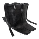 a matte black full grain horse culatta leather collar, meticulously hand stitched with an open seam construction. the scarf features a stonewashed ramie lining and riri zipper closures adorned with hand forged .925 sterling silver zipper pulls. available to buy online from avant garde leather studio atelierskn.com