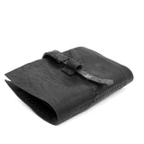 compact matte black horse leather wallet with a forged-iron shank closure and a zipper coin pocket, completely handmade in the UK by atelier SKN