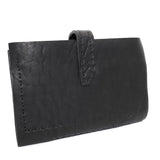 compact matte black horse leather wallet with a forged-iron shank closure and a zipper coin pocket, completely handmade in the UK by atelier SKN