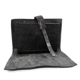 compact matte black horse leather wallet with a forged-iron shank closure and a zipper coin pocket, completely handmade in the UK by atelier SKN