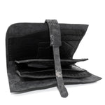 compact matte black horse leather wallet with a forged-iron shank closure and a zipper coin pocket, completely handmade in the UK by atelier SKN