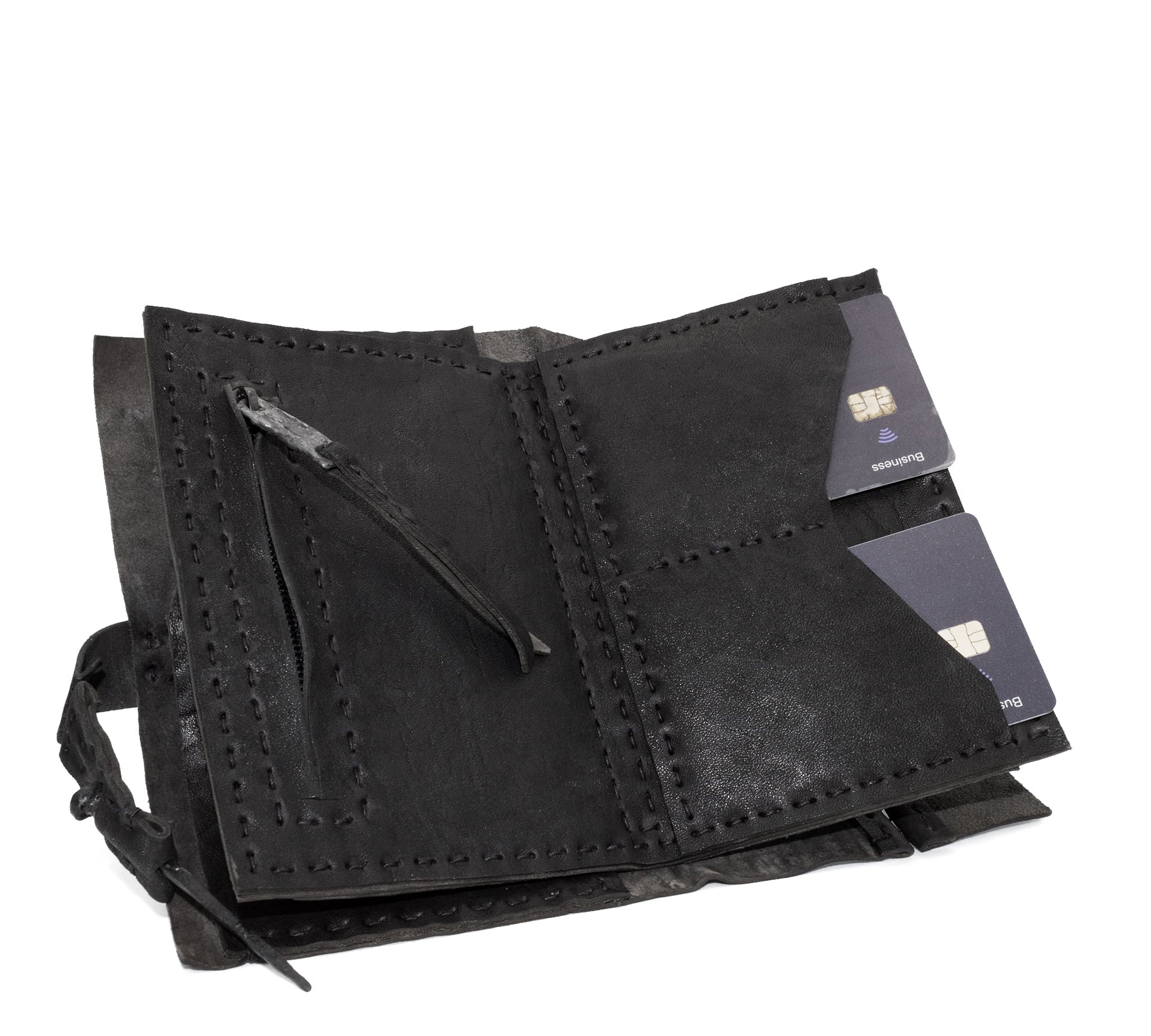 hand stitched matte black horse culatta leather long wallet with a technical open seam construction, multiple card slots and a large note pocket. the wallet is adorned with hand forged iron and .925 sterling silver hardware. available to buy online from artisanal leather studio atelier skn.