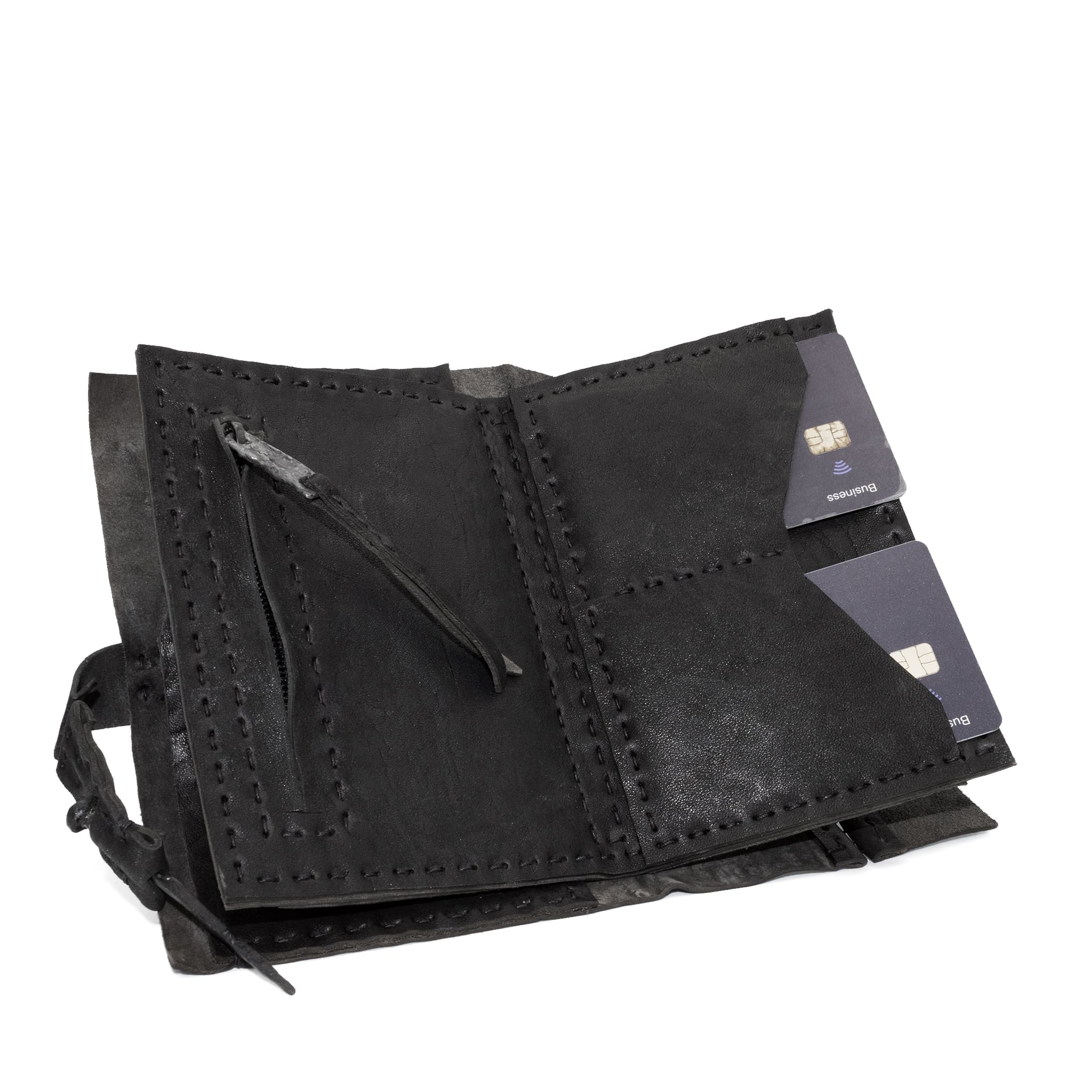 hand stitched matte black horse culatta leather long wallet with a technical open seam construction, multiple card slots and a large note pocket. the wallet is adorned with hand forged iron and .925 sterling silver hardware. available to buy online from artisanal leather studio atelier skn.