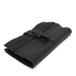 hand stitched matte black horse culatta leather long wallet with a technical open seam construction, multiple card slots and a large note pocket. the wallet is adorned with hand forged iron and .925 sterling silver hardware. available to buy online from artisanal leather studio atelier skn.