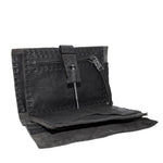 hand stitched matte black horse culatta leather long wallet with a technical open seam construction, multiple card slots and a large note pocket. the wallet is adorned with hand forged iron and .925 sterling silver hardware. available to buy online from artisanal leather studio atelier skn.