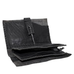 hand stitched matte black horse culatta leather long wallet with a technical open seam construction, multiple card slots and a large note pocket. the wallet is adorned with hand forged iron and .925 sterling silver hardware. available to buy online from artisanal leather studio atelier skn.