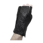 hand stitched over a 35hr period the washed reverse culatta gloves feature an open seam panel construction, a distressed black dye treatment and japanese linen thread for the stitching. the gloves are wet moulded on the body and available to buy online from avant garde leather studio atelierskn.com 