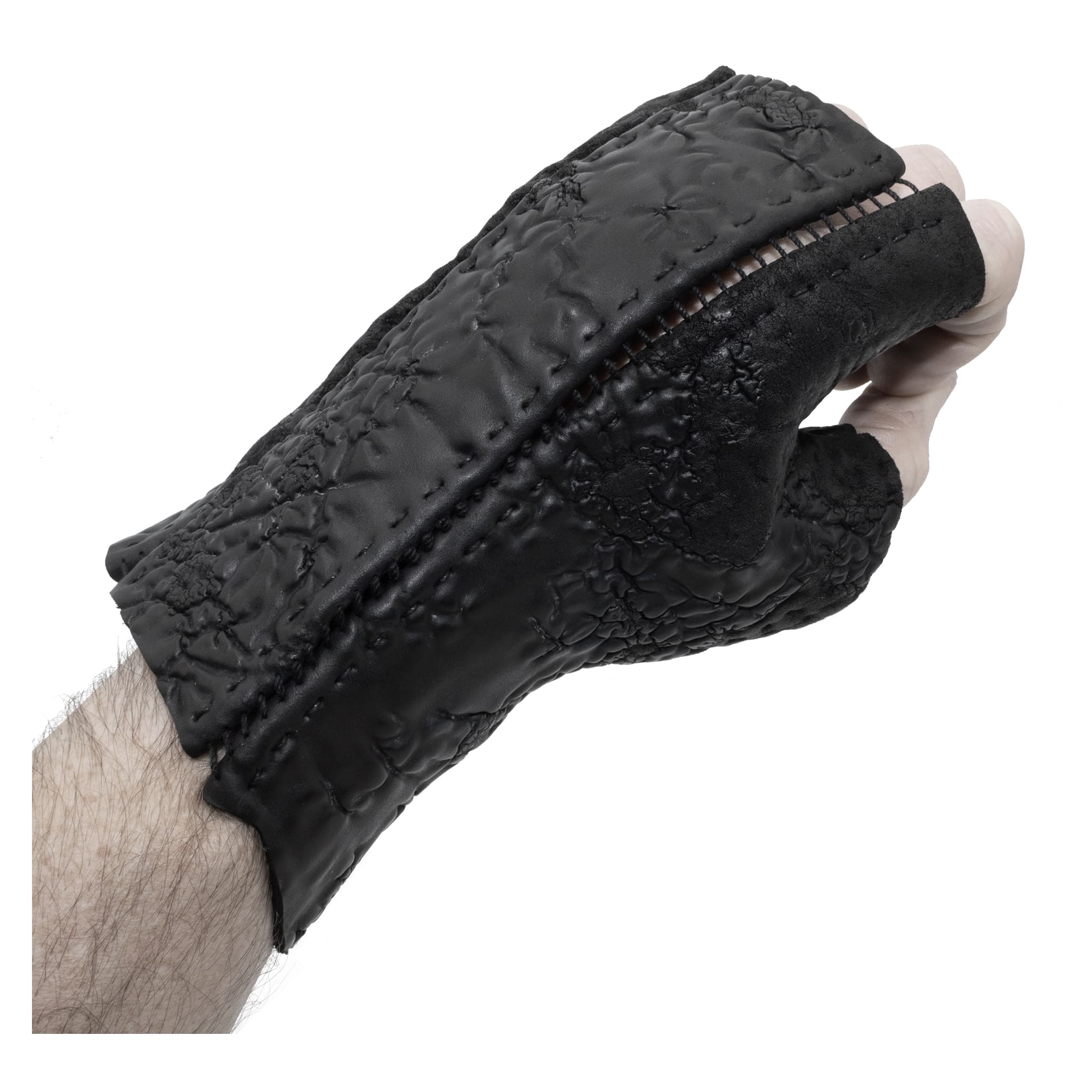 hand stitched over a 35hr period the washed reverse culatta gloves feature an open seam panel construction, a distressed black dye treatment and japanese linen thread for the stitching. the gloves are wet moulded on the body and available to buy online from avant garde leather studio atelierskn.com 