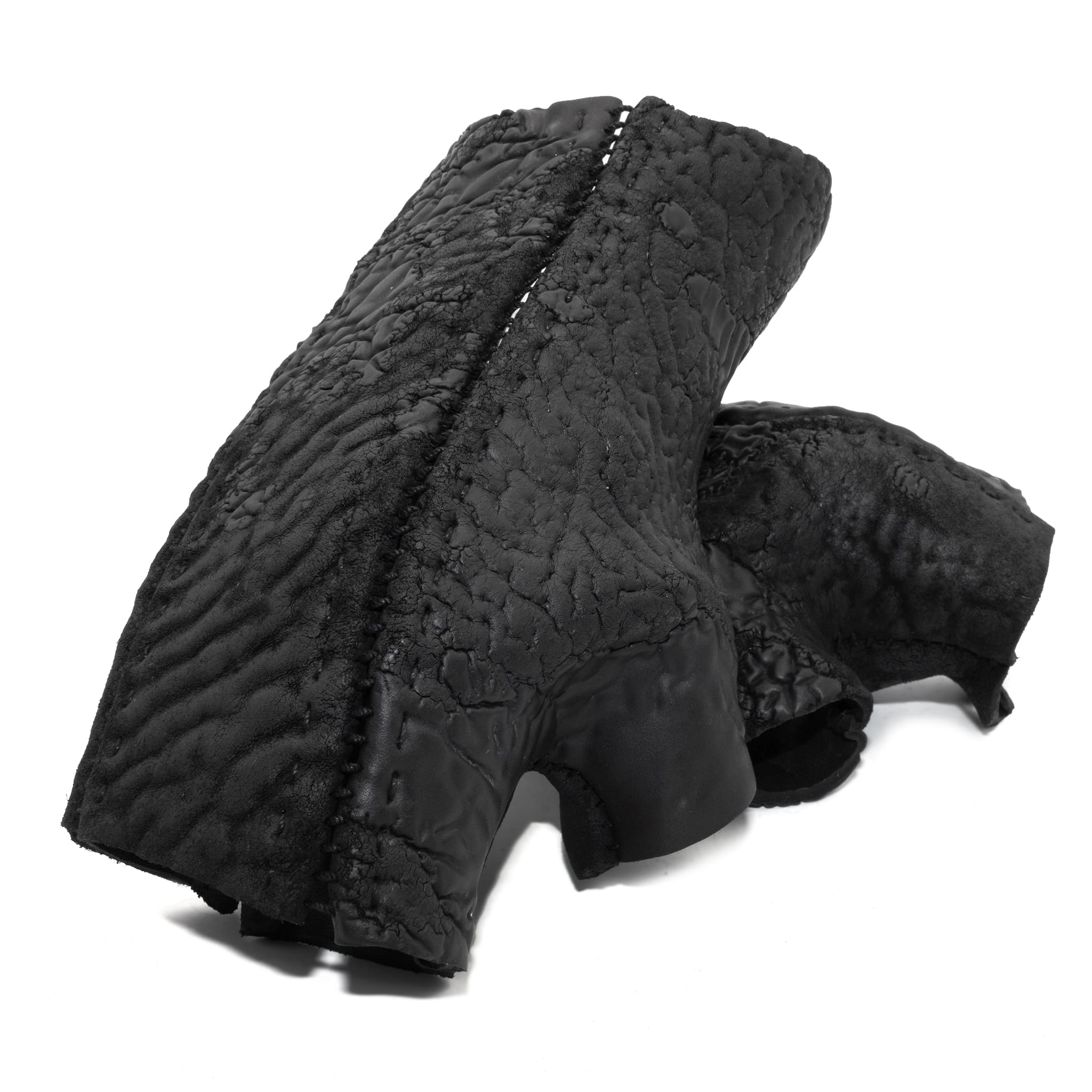 hand stitched over a 35hr period the washed reverse culatta gloves feature an open seam panel construction, a distressed black dye treatment and japanese linen thread for the stitching. the gloves are wet moulded on the body and available to buy online from avant garde leather studio atelierskn.com 
