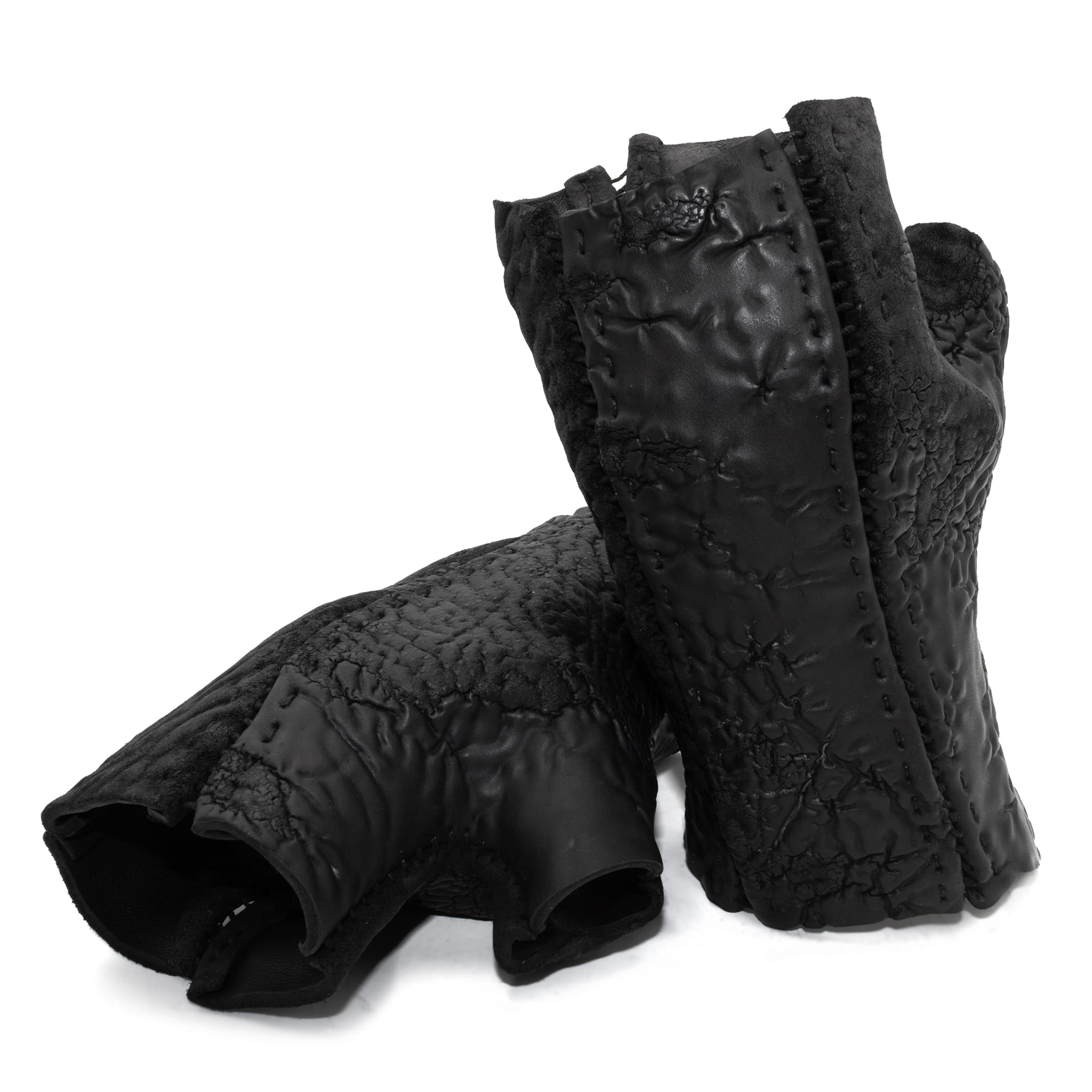 hand stitched over a 35hr period the washed reverse culatta gloves feature an open seam panel construction, a distressed black dye treatment and japanese linen thread for the stitching. the gloves are wet moulded on the body and available to buy online from avant garde leather studio atelierskn.com 