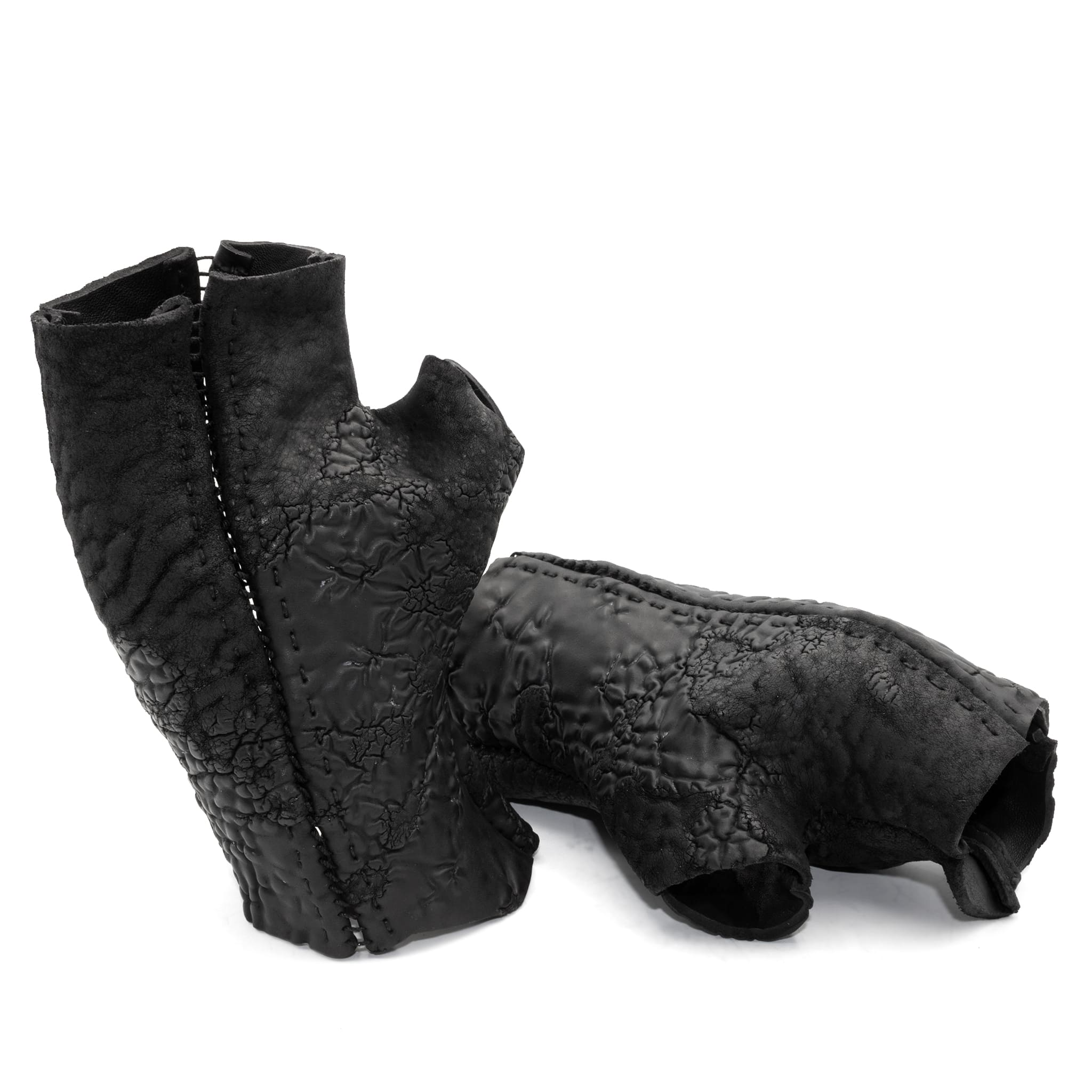 hand stitched over a 35hr period the washed reverse culatta gloves feature an open seam panel construction, a distressed black dye treatment and japanese linen thread for the stitching. the gloves are wet moulded on the body and available to buy online from avant garde leather studio atelierskn.com 