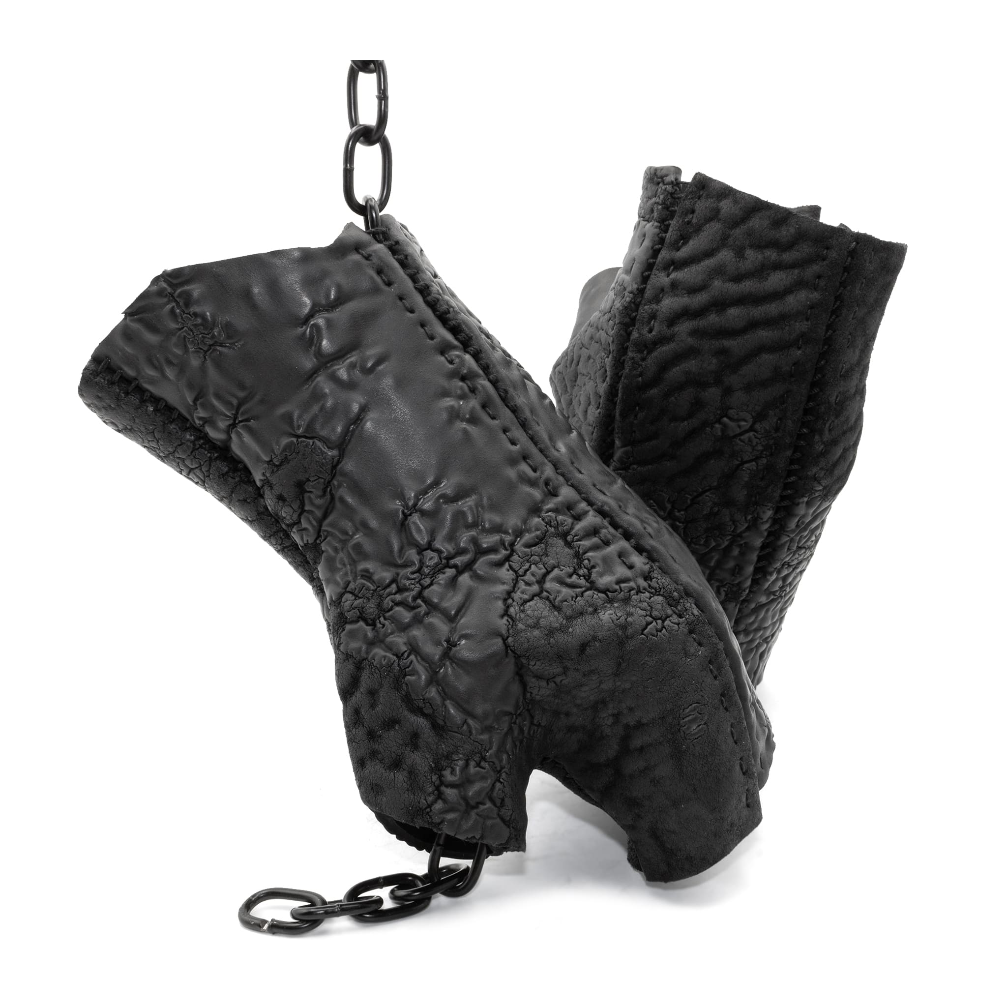 hand stitched over a 35hr period the washed reverse culatta gloves feature an open seam panel construction, a distressed black dye treatment and japanese linen thread for the stitching. the gloves are wet moulded on the body and available to buy online from avant garde leather studio atelierskn.com 